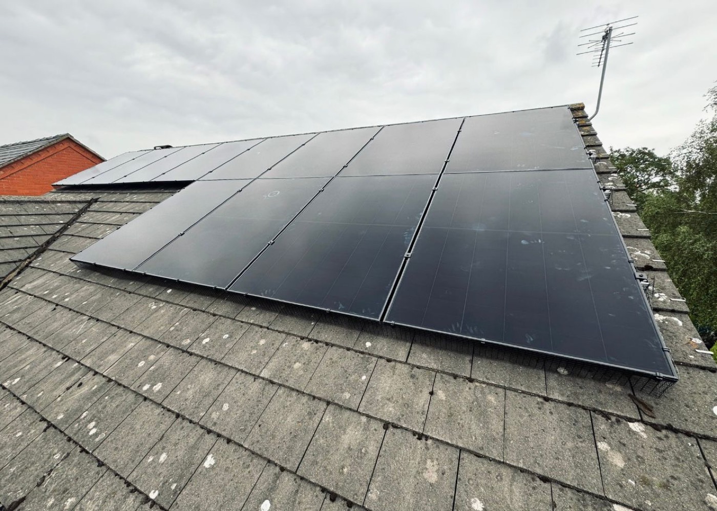 Black solar panels on a pitched roof